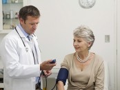 doctor taking blood pressure