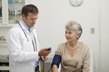 doctor taking blood pressure