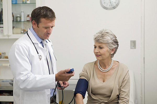 doctor taking blood pressure