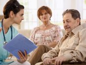 Nurse talking with elderly paitents